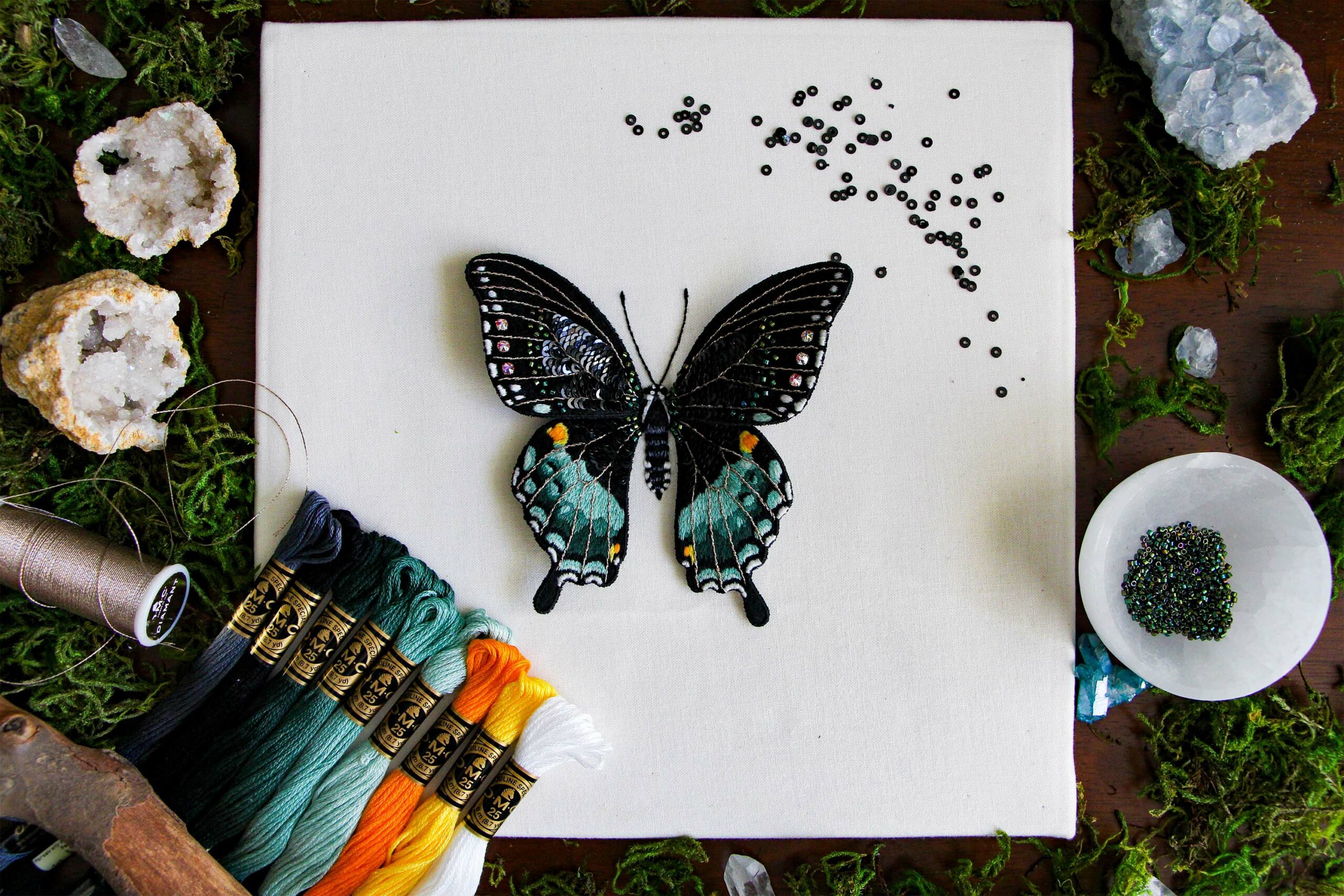 The finished 3D Spicebush Swallowtail embroidery with DMC thread colors