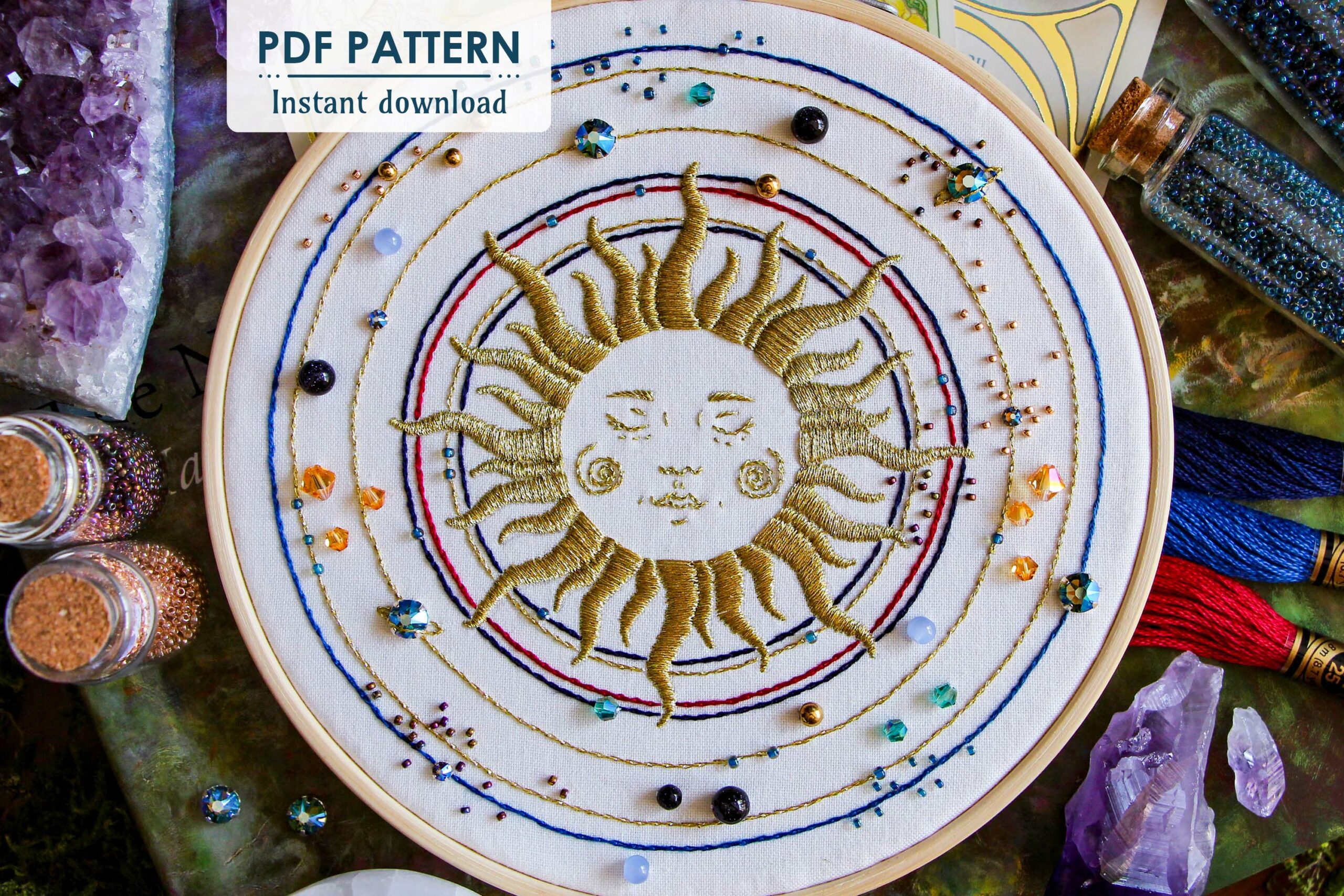 Photo of the Sun Galaxy bead embroidery pattern with "PDF Pattern" sticker and surrounded by embroidery materials