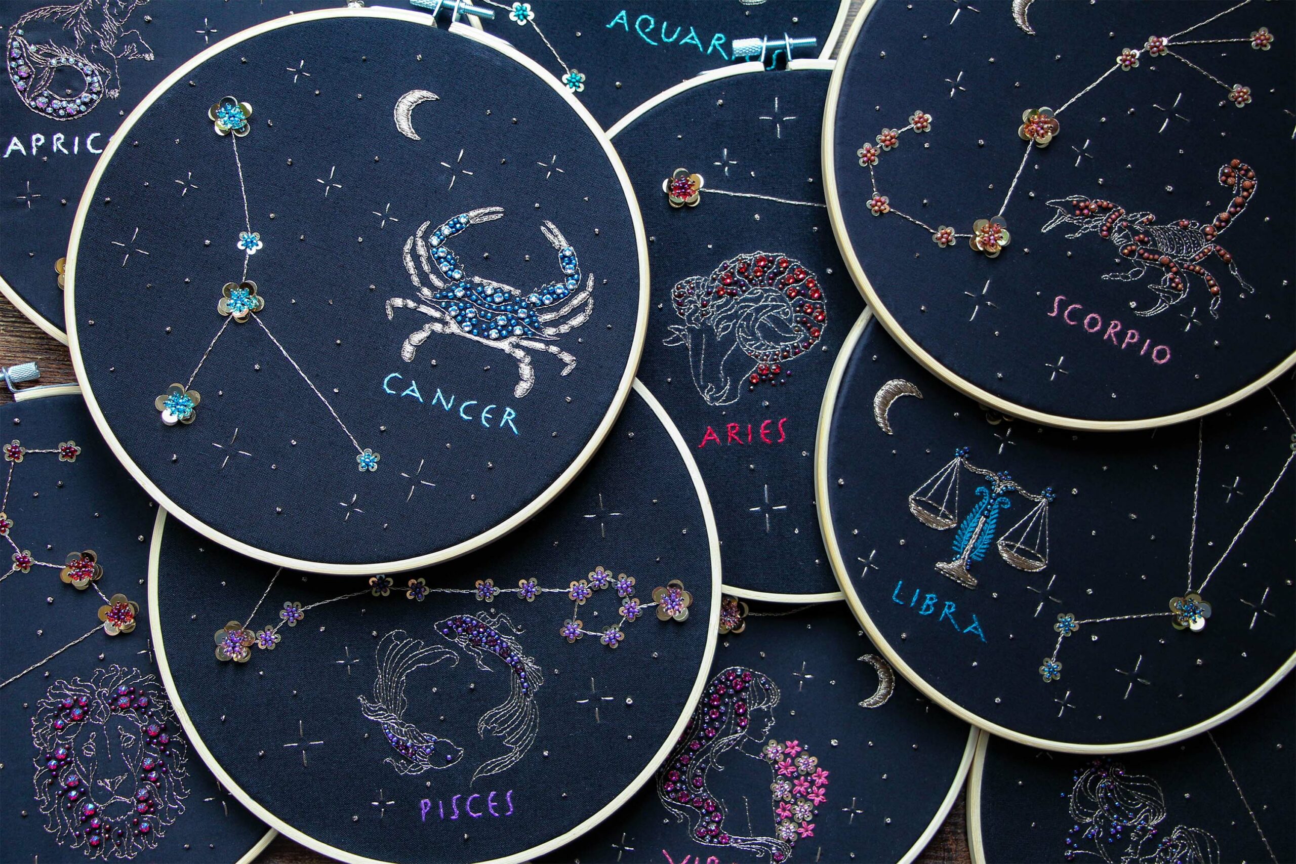 Grouping of the Zodiac series embroideries